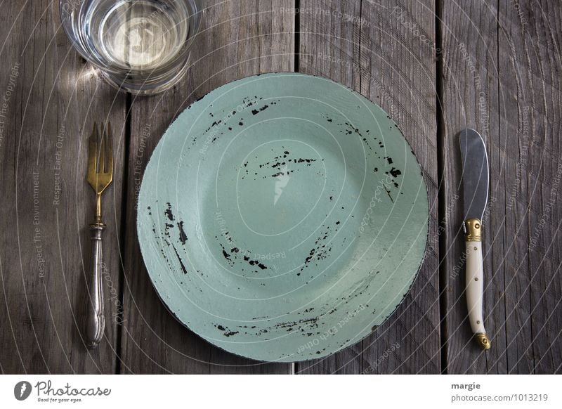 Lent, an empty plate with knife and fork and a glass of water on a rustic wooden table Nutrition Eating Breakfast Lunch Diet Fasting Beverage Cold drink