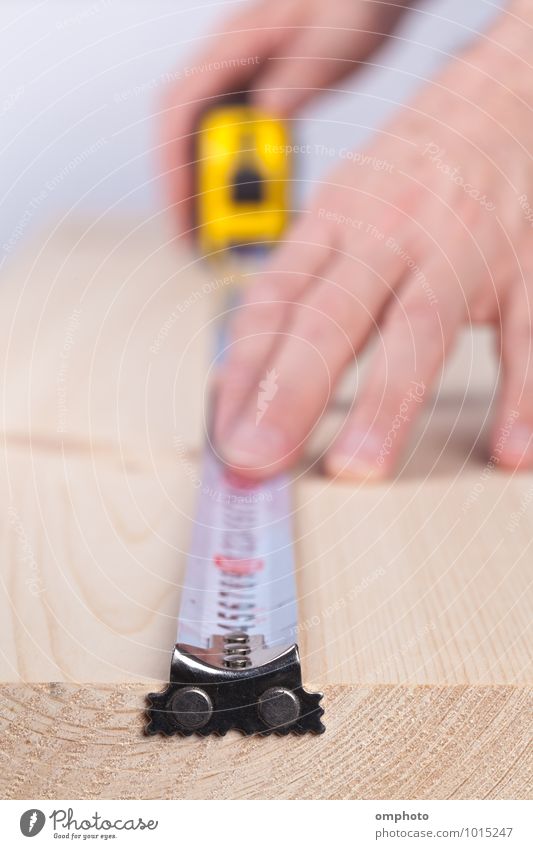 Worker measures a wooden plank by tape measure Work and employment Profession Workplace Construction site Factory Industry Tool Tape measure Masculine Man