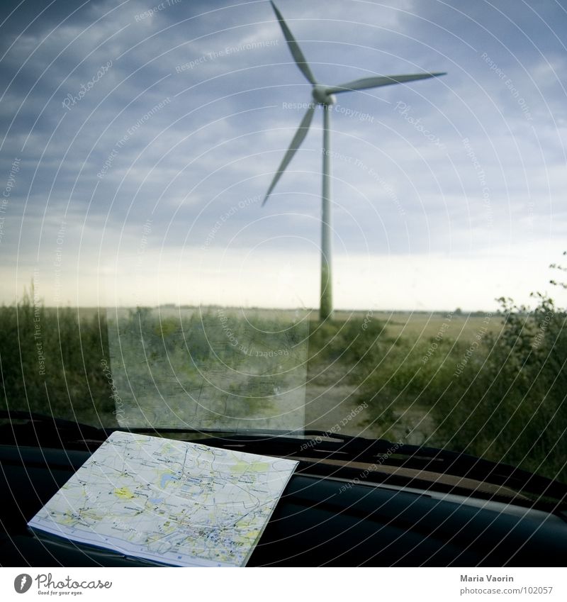Honey, I think we're lost! Vacation & Travel Motoring Break Map Dark Clouds Bad weather Storm Propeller Wind energy plant Electricity Environment