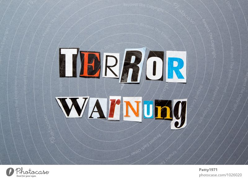 terror warning Newspaper Magazine Paper Sign Characters Typography Threat Fear Aggression Force Hatred Society Politics and state Surveillance Anonymous Low-cut