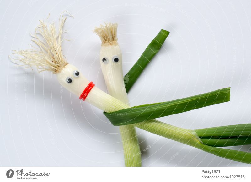 Shallots with glued on googly eyes represents a dancing couple Vegetable Onion Dance To hold on Embrace Together Colour photo Couple Love Happy Infatuation