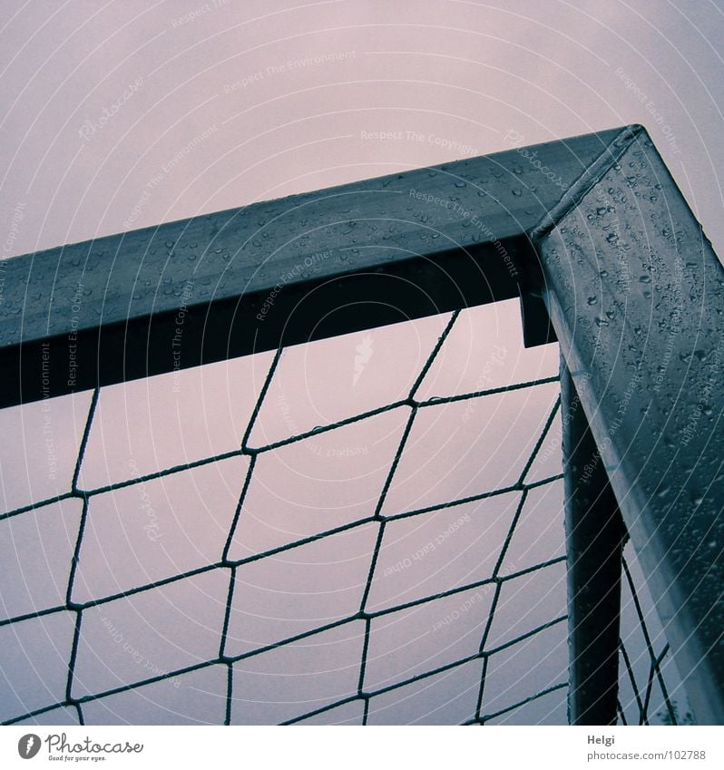 upper corner of a soccer goal with net and raindrops in front of a grey sky Soccer Goal Sharp-edged Gray Wet Rain Loop Playing Corner Playground Foot ball