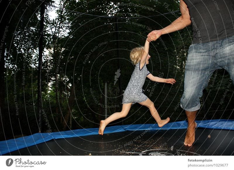 bouncing kid on trampoline Trampoline Playing Hop Jump Garden Child Man Infancy Movement Father Together Joy Happy fun Happiness Joie de vivre (Vitality)