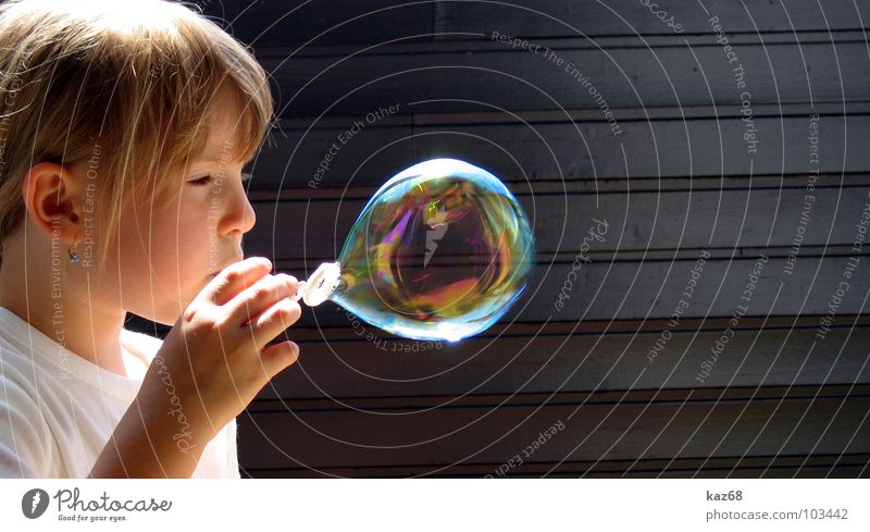 soap bubble Soap bubble Round Blow Rainbow Happiness Multicoloured Air Black Whim Background picture Wood Playing Action Caustic solution Girl Blonde