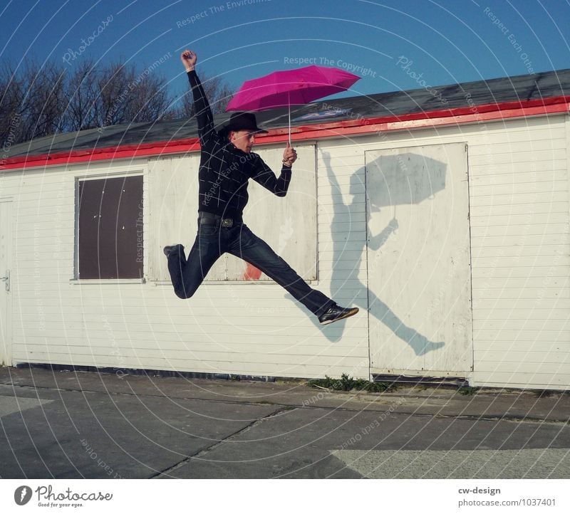 now but quickly - young man sporty with umbrella swift hurry up now Man Athletic Jump Hop Umbrellas & Shades Sunshade Human being Joy Adults Day Colour photo