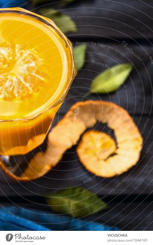 Citrus juice in a glass on a dark table Beverage Juice Glass Style Design Restaurant Nature Retro Vintage Vitamin Citrus fruits Leaf Table Healthy Eating
