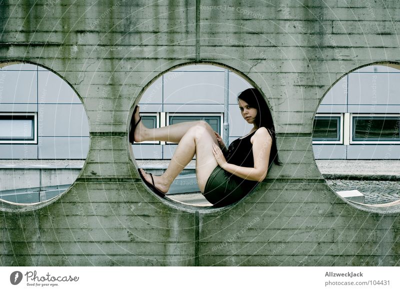 right in the middle Concrete Wall (building) Circle Hollow Round Wall (barrier) Cement Gray Woman 3 Middle Modern Boredom Sit Wait Relaxation Detail