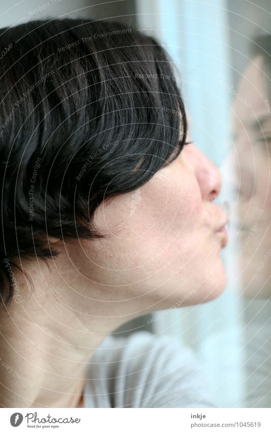 close-up woman kisses her reflection in the window pane Lifestyle Leisure and hobbies Woman Adults Face 1 Human being 30 - 45 years Window Kissing Emotions