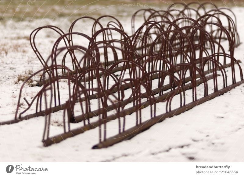 . Bicycle rack Means of transport Cycling Old Broken Gloomy Brown White Snow Abstract Colour photo Exterior shot Deserted Day
