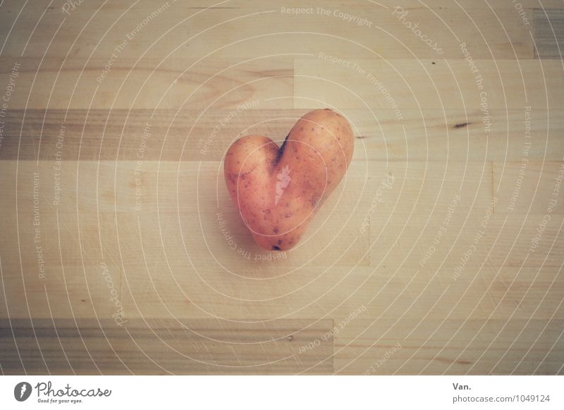 A heart for potatoes Food Potatoes Wood Yellow Middle Chopping board Heart Colour photo Subdued colour Interior shot Deserted Neutral Background Day
