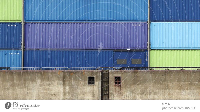 Biscuit tins XXXXXXXL Colour photo Exterior shot Day Ocean Industry Logistics Harbour Wall (barrier) Wall (building) Watercraft Container Packaging Tin Stone
