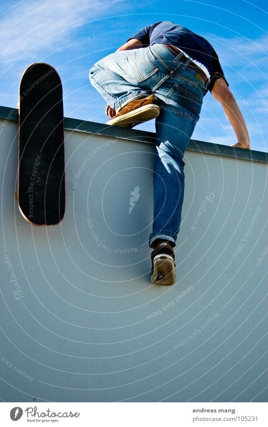 Here we go Man Skateboarding Wall (building) Above Sky Illegal Effort Going Get in Bans Clouds Speed Escape Come Climbing climp up Tall blue Lanes & trails