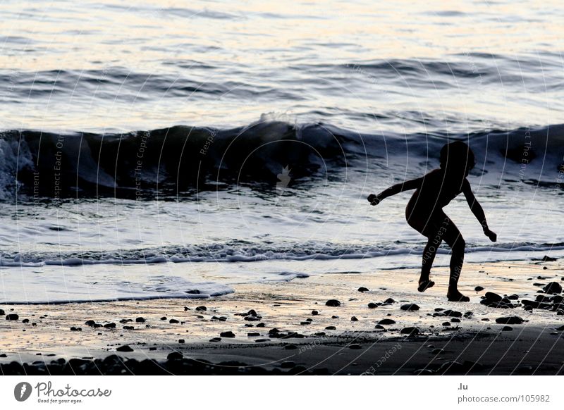 child jumps Vacation & Travel Child Ocean Monster Sunset Playing Jump Waves Beach Joy Contrast tramp Water Sand