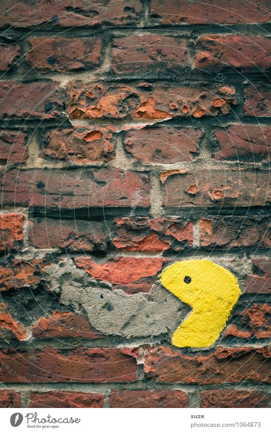grungy Playing Wall (barrier) Wall (building) Facade To feed Old Broken Small Funny Yellow Appetite Brick wall Pacman Smiley Background picture Vomiting