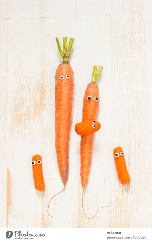 carrot family Vegetable Carrot Child Baby Parents Adults Mother Father Family & Relations Friendliness Happiness Fresh Healthy Together Happy Funny Cute Orange