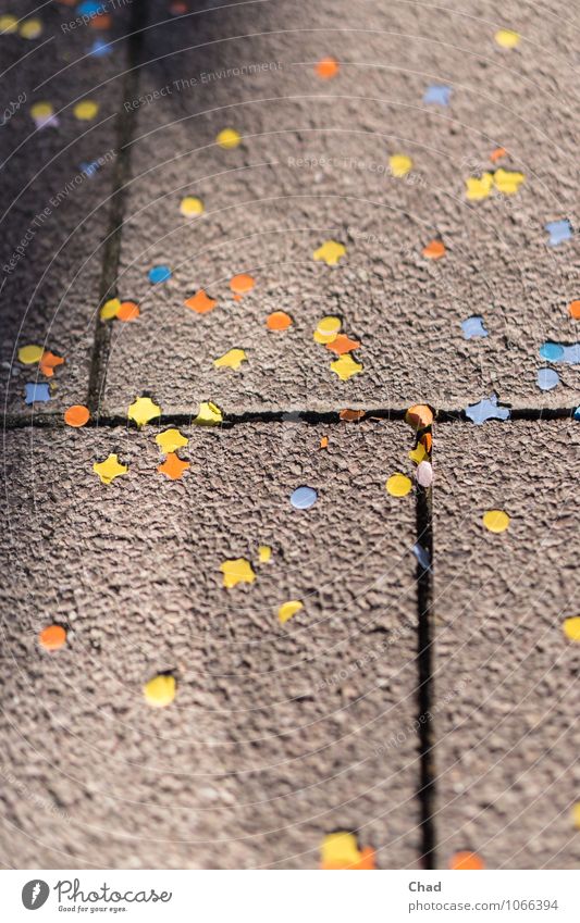 Carnival Rest Joy Feasts & Celebrations Fairs & Carnivals Birthday Lanes & trails Sidewalk Footpath Confetti Paper Stone Concrete Happiness Town Blue Yellow