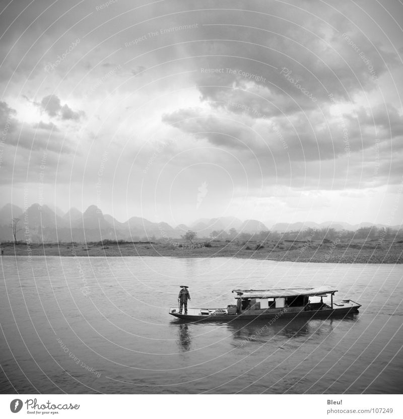 Li.yang China Guilin Chinese Black & white photo Asia Water li-yang storm boat landscape mountains grey
