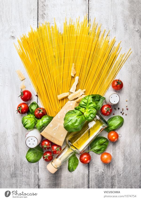 Spaghetti and ingredients for tomato sauce Food Vegetable Dough Baked goods Herbs and spices Cooking oil Nutrition Lunch Dinner Organic produce Vegetarian diet