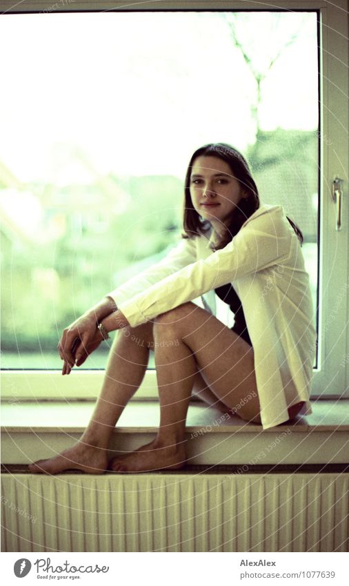 window seat Flat (apartment) Room Window Young woman Youth (Young adults) Legs Feet 30 - 45 years Adults Jacket Barefoot Brunette Long-haired Heater Window seat