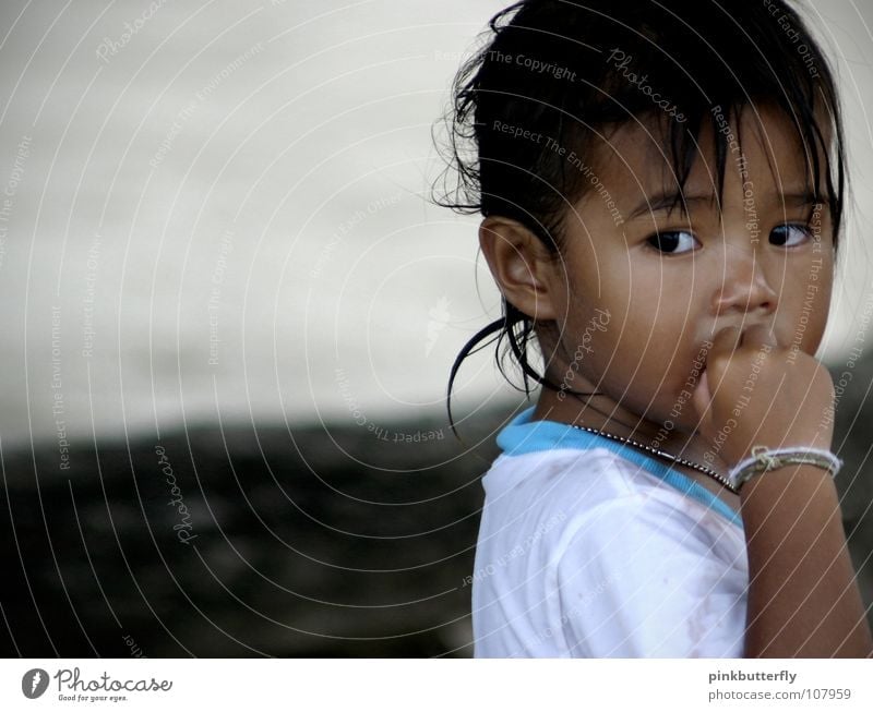 little Thai Girl ;c) Child Small Portrait photograph Black-haired Longing White Cold Freeze Beach Beautiful Friendliness Expectation Toddler Fear Panic Face