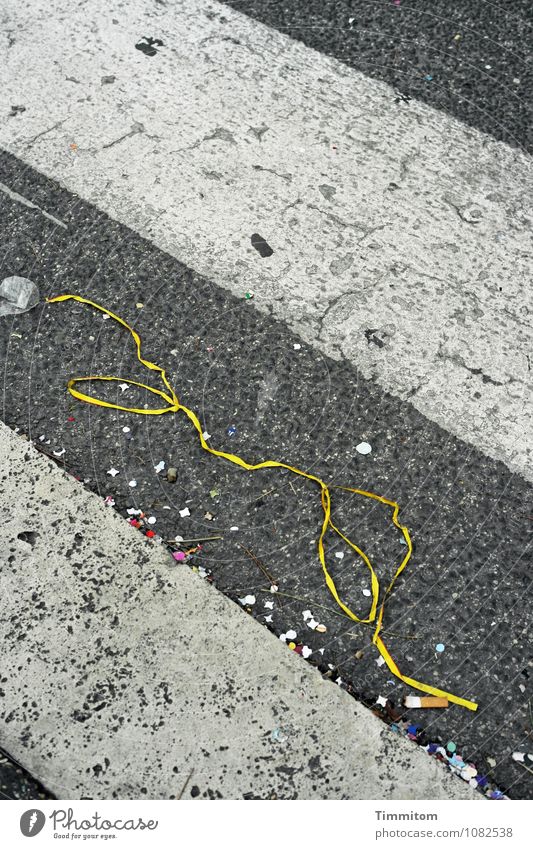 Somewhere in Rome the remains of a celebration Street Confetti Paper streamers Cigarette Butt Plastic Signs and labeling Lie Dirty Yellow Gray Red White