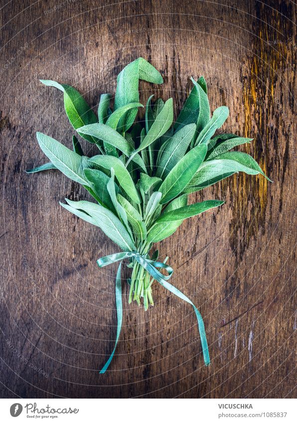 Sage bunch with bow on wooden table Food Herbs and spices Style Design Healthy Medical treatment Alternative medicine Life Garden Nature Spring Summer Autumn
