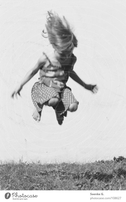 jump Child Girl Jump Wall (barrier) Meadow Playing Dream Hippie Romp Joy Black & white photo Hair and hairstyles Tall Shadow little child daydream