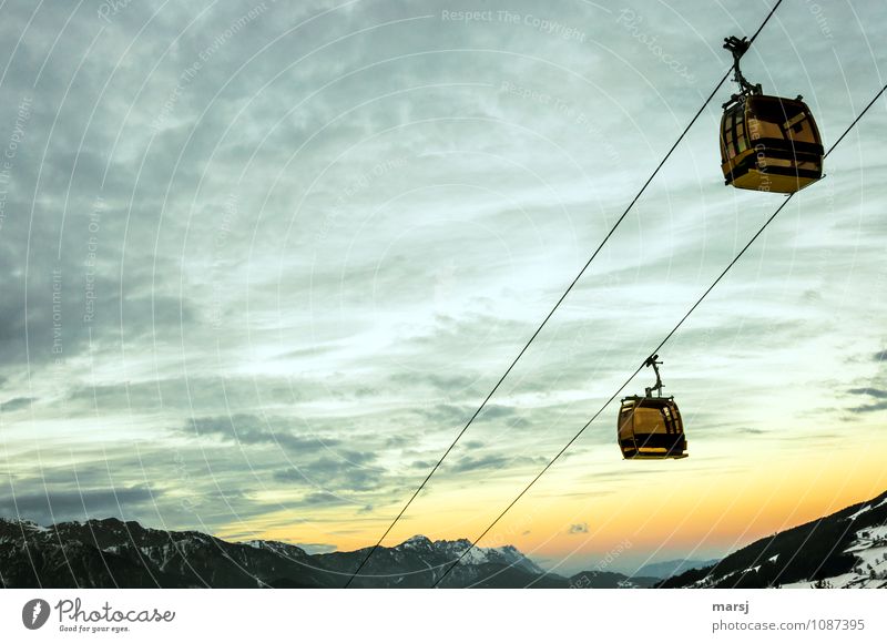 It'll be over soon Clouds Sunrise Sunset Sunlight Winter Weather Beautiful weather Means of transport Cable car Gondola Dark Vacation & Travel Horizon Rope Dusk