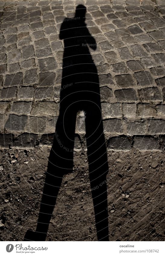 Mistress long leg Shadow play Drop shadow Silhouette Light Earth colour Colossus Ghosts & Spectres  body outline Sand Street Cobblestones Stone Lanes & trails