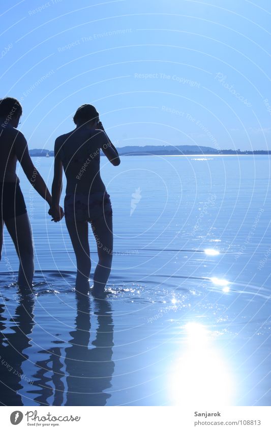 Freshly in love II Lake Chiemsee Ocean Waves Reflection Clouds Bavaria Summer Vacation & Travel Lovers Cold Wet Hold hands Water Blue Sun Coast Sky August