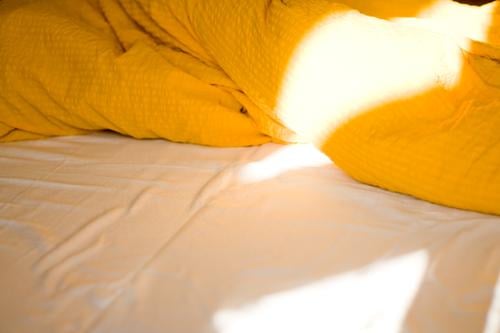 bed Bed Bedclothes Duvet Blanket Sheet Cushion Light Bedroom Arise Morning Sunrise Quilt Downy feather Warmth Cozy Deserted Empty Sleeping place Sunlight Yellow