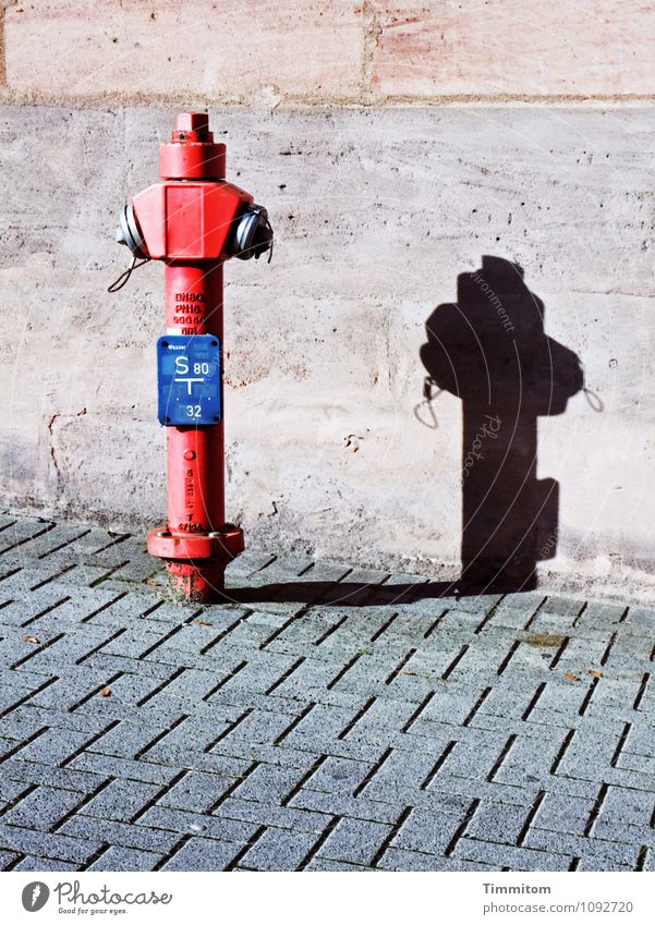 Stand by me. Wall (barrier) Wall (building) Fire hydrant Concrete Metal Line Sharp-edged Firm Clean Blue Gray Red Black Emotions Shadow Places Paving stone