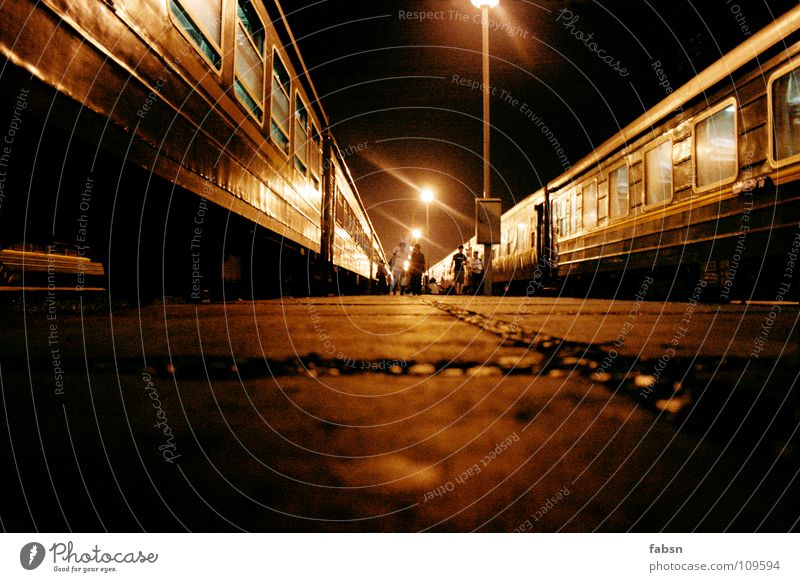 BETWEEN THE TRAINS Railroad Night Dark Driving Asphalt Light Lantern Eerie Criminal Public service Train station Asia train darkness go with Floor covering