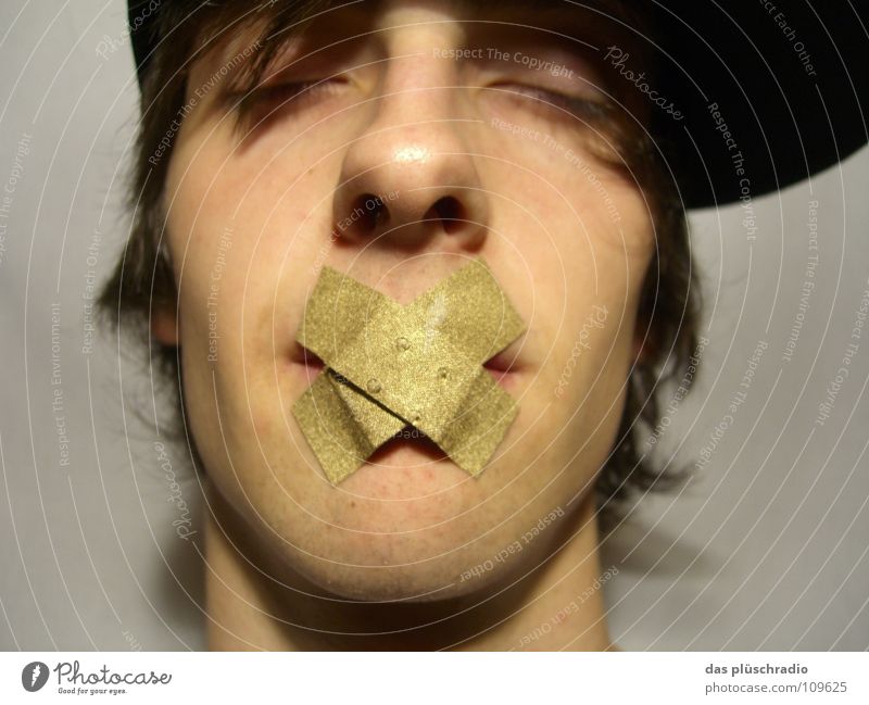psst... Adhesive plaster To be silent Closed eyes Lips Baseball cap Communicate Gold Face Calm silence is gold Nose