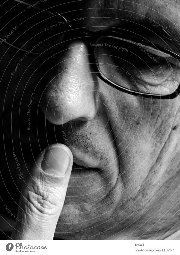 thumb Man Thumb Eyeglasses Reading Think Thought 50 plus portrait Concentrate Magazine Face ponder Wrinkles young old Dreamily