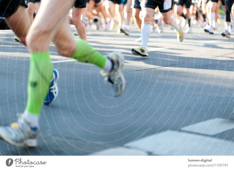 Legs of marathon runners Jogging Woman Adults Man Feet Street Stockings Sneakers Walking Together Speed Endurance Effort Target leg Berlin Energy Events group