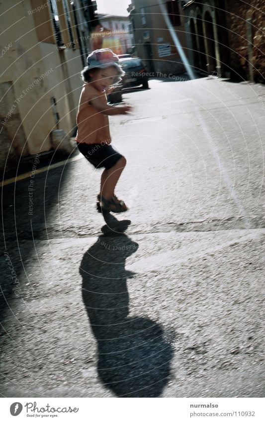 shadow play Shadow play Child Hop Jump Playing Childlike Alley Play street Traffic infrastructure Joy Girl 3 years own shadow Movement yourself Nature Free