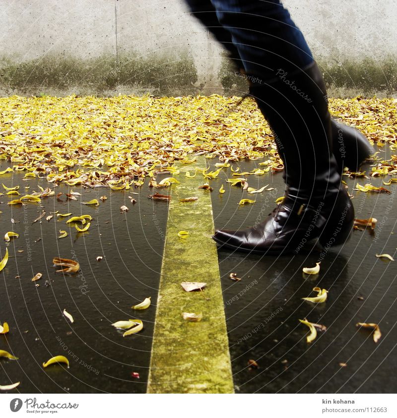signal_color_01 Woman Adults Feet Water Autumn Rain Leaf Parking garage Lanes & trails Jeans Leather Boots Concrete Signs and labeling Jump Wet Yellow Gray