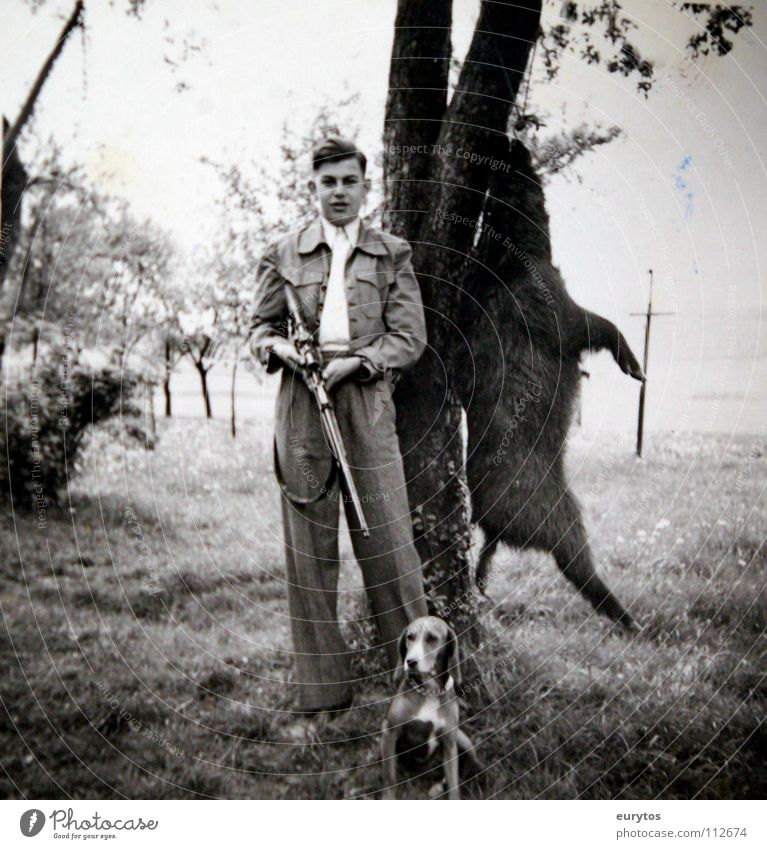 the sow is dead... Hunter Dog Hound Wild boar Black White Black & white photo Tree Meadow The fifties Sixties Nostalgia Old-school Chic Suit Tin