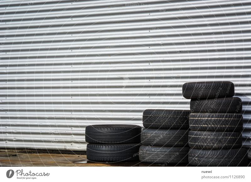tire stacks Racecourse Workplace Trade Services Technology Wall (barrier) Wall (building) Transport Means of transport Motoring Tire Old New Black Silver Safety