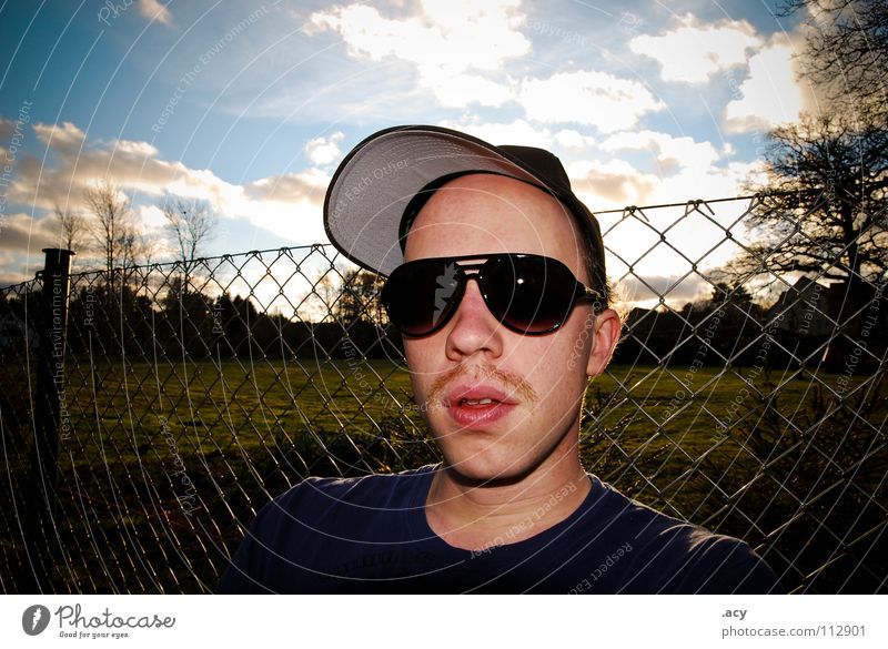 kalle chills Moustache Upper lip Facial hair Pornography Eyeglasses Sunglasses East Wire netting Wire netting fence Fence Clouds Portrait photograph