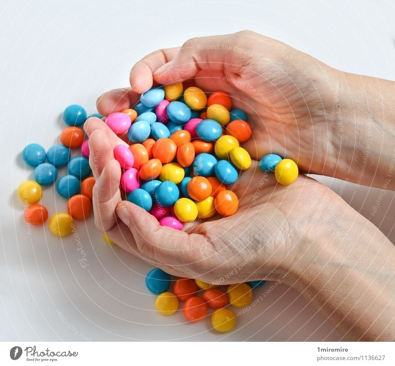 Colored candy Food Candy Hand Delicious Sweet Yellow Green White Colour colorful Confectionary Hold Snack Sugar sweets Unhealthy yummy hands Colour photo