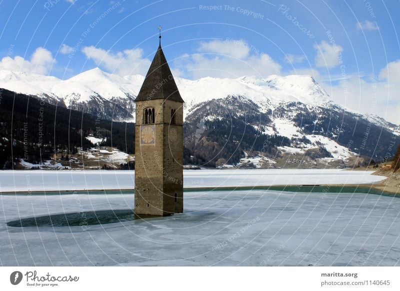 Church tower in lake Reschensee Landscape Water Sky Spring Beautiful weather Mountain Glacier Coast Lakeside Old town Deserted Tower Tourist Attraction Blue