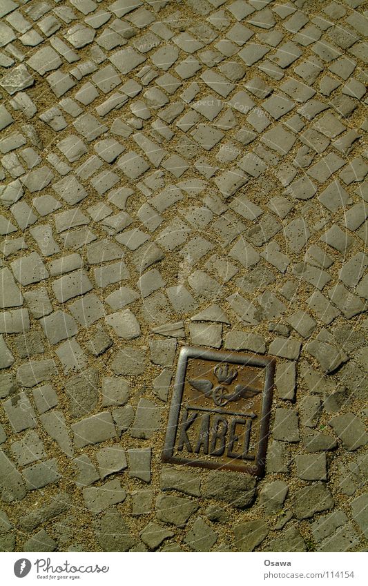 Heidi Iron Cast iron Cobblestones Granite Floor covering Places Friedrichshain Traffic infrastructure Cable Signs and labeling Wing Rust Stone Street Ostkreuz