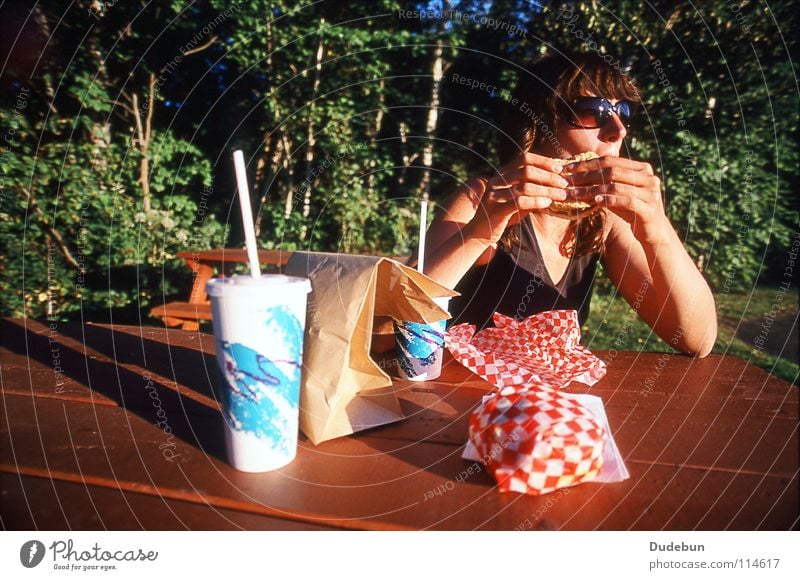 The Tasty Treat Colour photo Exterior shot Copy Space top Day Shadow Sunlight Wide angle Upper body Looking away Hamburger Nutrition Fast food Cold drink Summer