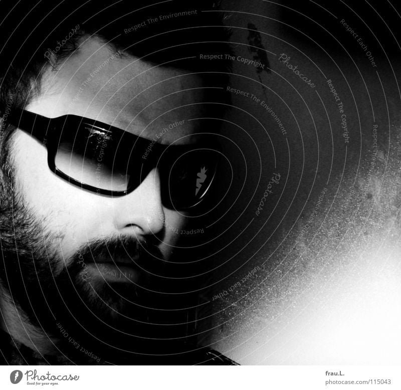 sunglasses Man Eyeglasses Sunglasses Sunlight Attractive Masculine Facial hair Mysterious portrait Wall (building) Moustache Human being Black & white photo