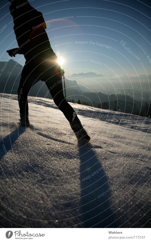 Tracks in the snow II Winter To go for a walk Speed Horizon Dornbirn Federal State of Vorarlberg Austria Woman Coat Back-light Snow Walking Running Movement Sun