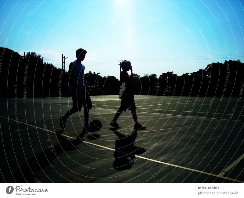summerlife Colour photo Exterior shot Shadow Silhouette Leisure and hobbies Playing Summer Sportsperson Soccer Foot ball Ball Sporting Complex Sporting grounds
