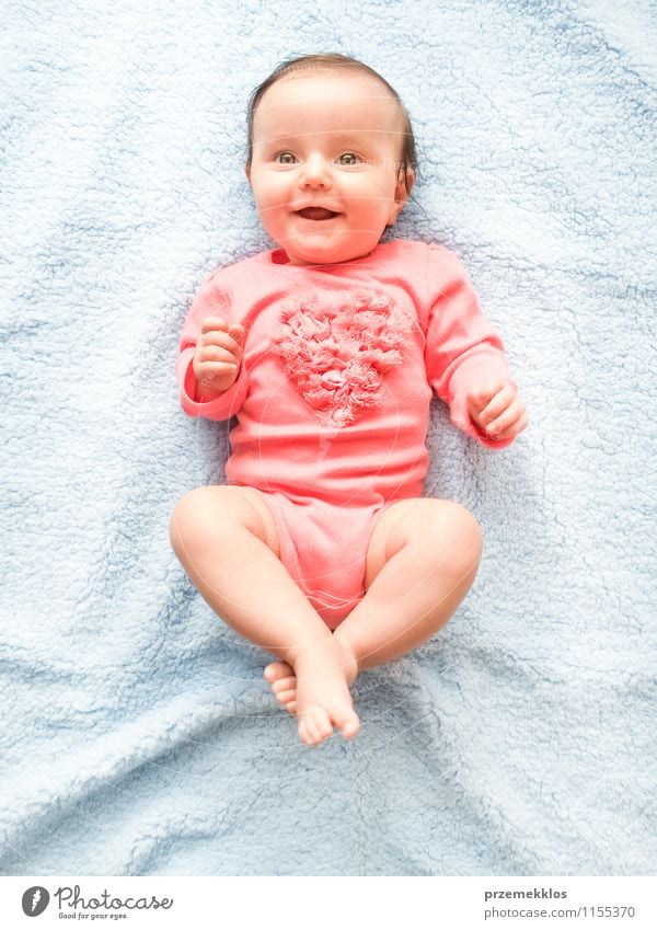 Heart beating Happy Beautiful Child Baby Girl Infancy 0 - 12 months Smiling Happiness Small Cute Blue Pink blanket cheerful kid Colour photo Interior shot Day