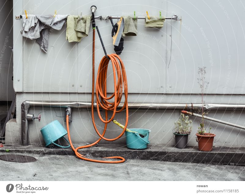 washing place Facade Town Cleaning Car wash Iron-pipe Tap Water Dry Towel Floor cloth Hang up Bucket Colour photo Exterior shot Deserted Day
